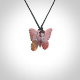 Small Butterfly design pendant carved in Red Agate. Real Agate jewellery for sale online with NZ Pacific. Small butterfly pendant hand made in red agate, provided with adjustable cord and packaged in a woven kete pouch.